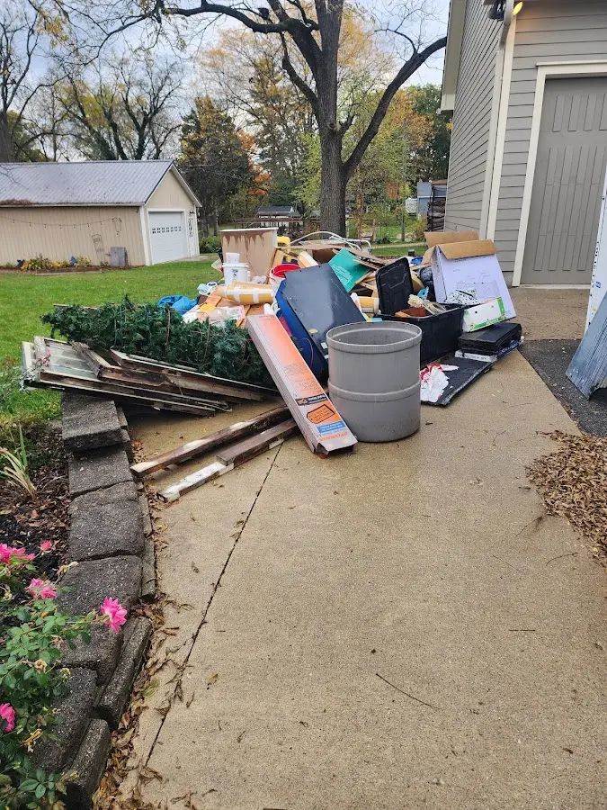 Dumpster being loaded with debris for 30 Yard Dumpster Rental in Camillus